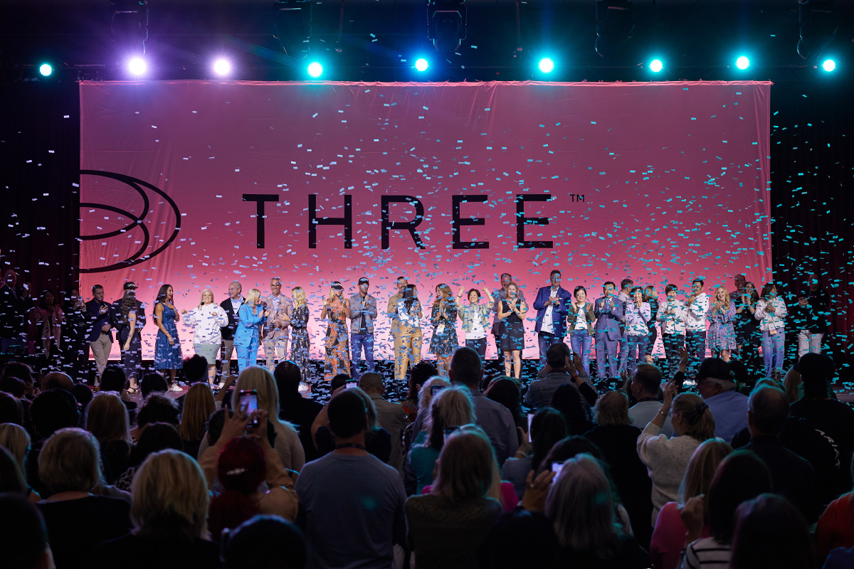 confetti falls on stage at the THREE international convention in anaheim california